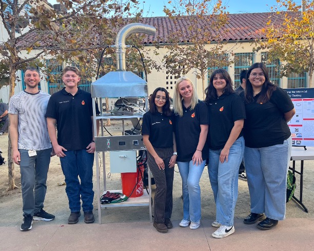 Picture of cone calorimeter team. From left to right: Prof. Carmignani (sponsor), Liam McCarty, Diana Chavez, Olivia Towers, Emily Halsey, Yani Rincon Ochoa